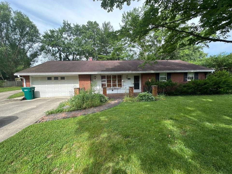 The brick ranch and its attached garage from the front lawn before the new roof, Beavercreek, Ohio.