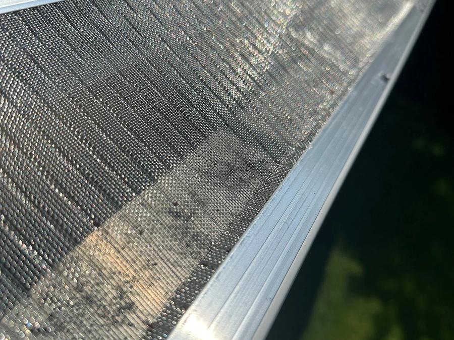 Close view of the stainless steel mesh gutter guard screwed to the front of the new gutter on Blocker Dr, Kettering, Ohio.