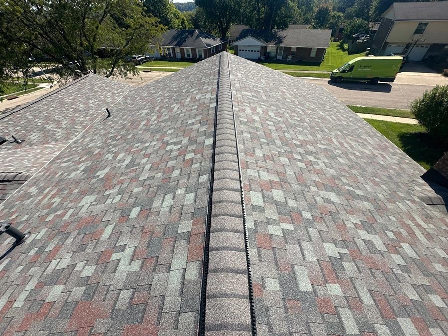 Ridge vent along the finished hip roof, with the street below, West Carrollton, Ohio.