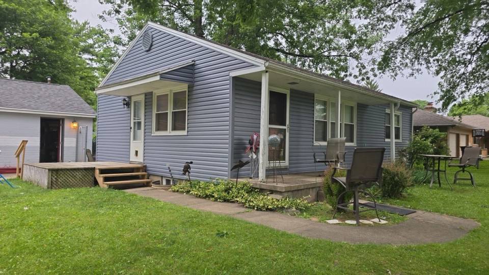 The finished vinyl siding on the ranch house, seen from the side yard, Beavercreek, Ohio.