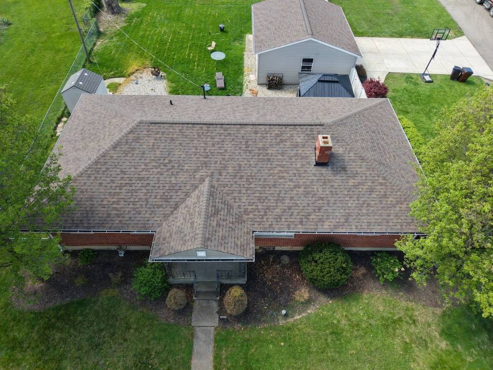 Drone photo of the finished roof and sheathing replacement on the brick ranch, Beavercreek, Ohio.