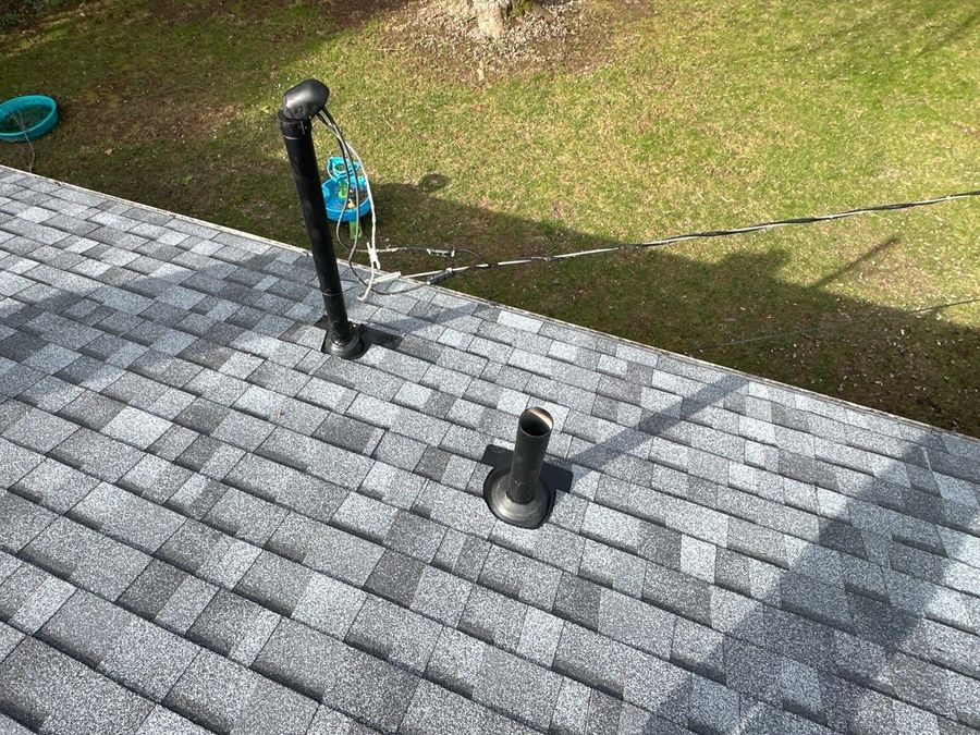 New pipe boots on the finished gray shingles on Napanee Dr, Beavercreek, Ohio.